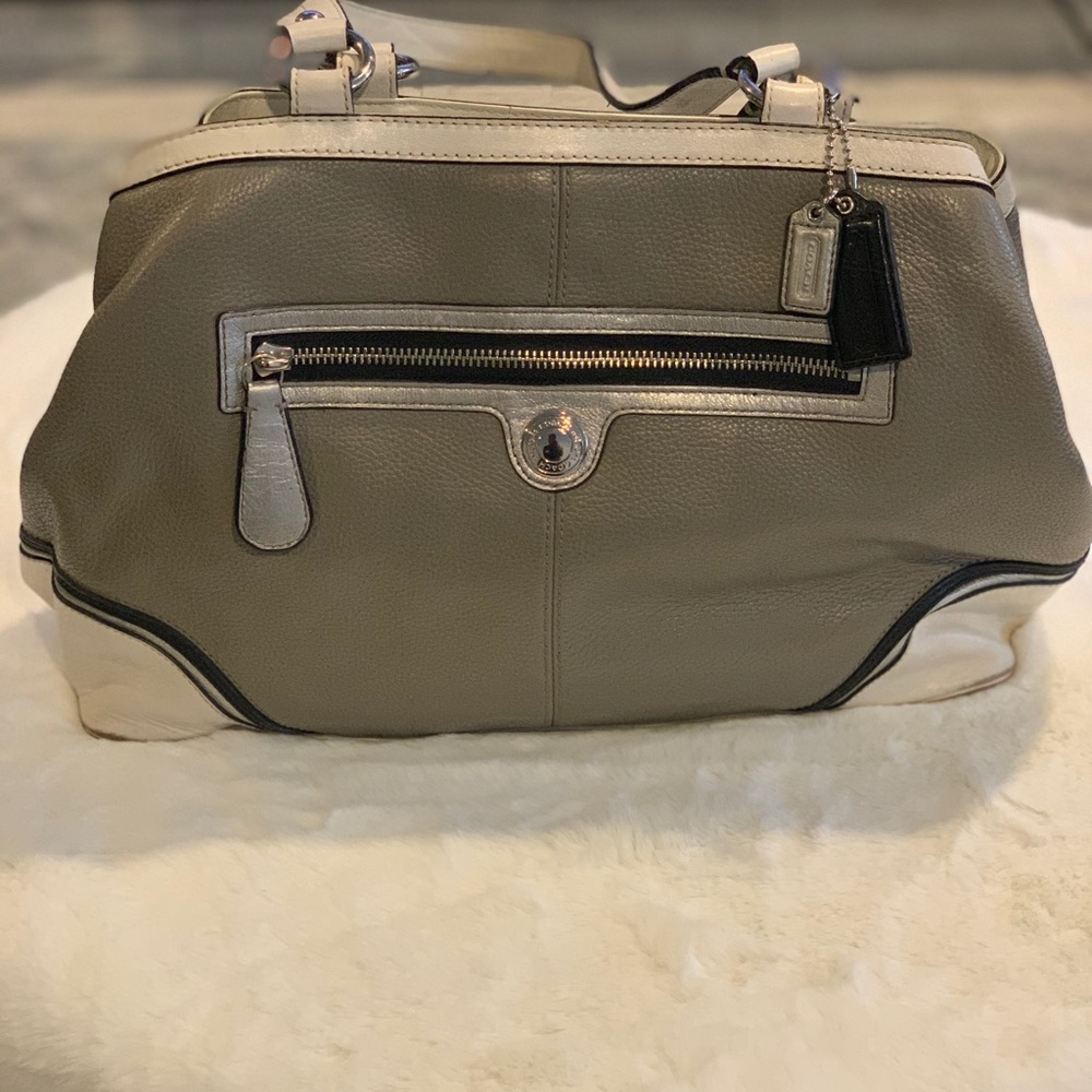 Authentic Coach purse with pocketbook closure.